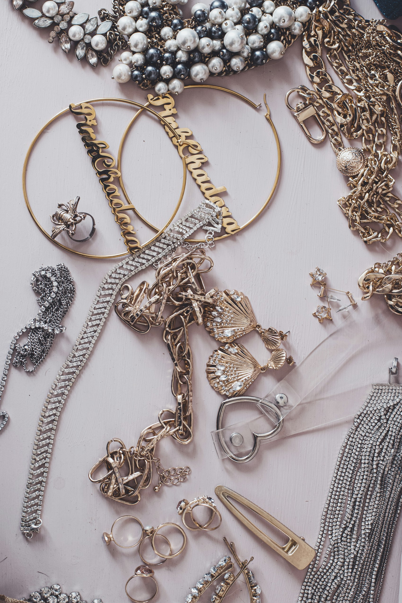 Gold-tone jewelry and pearl-look pieces arranged together.