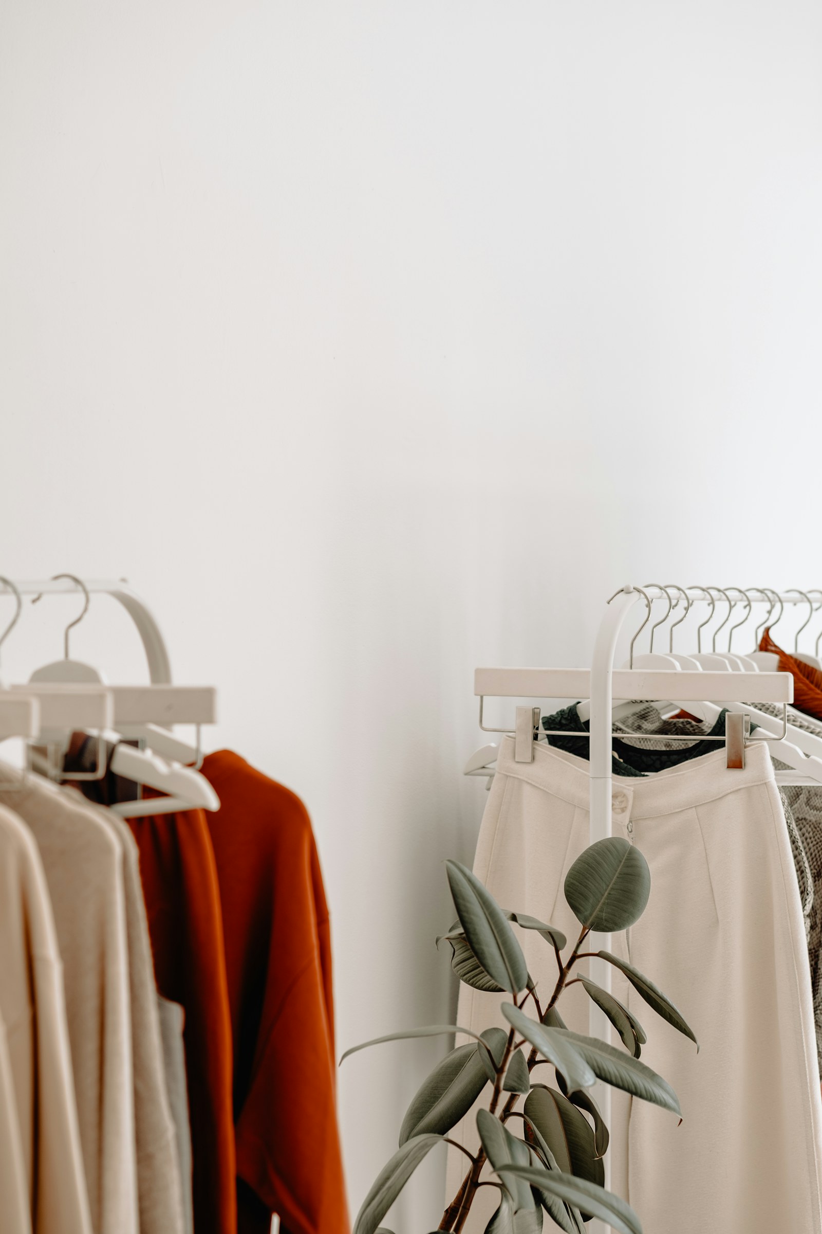 Minimal clothing rack in a bright styling studio.